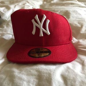 Yankees baseball cap.